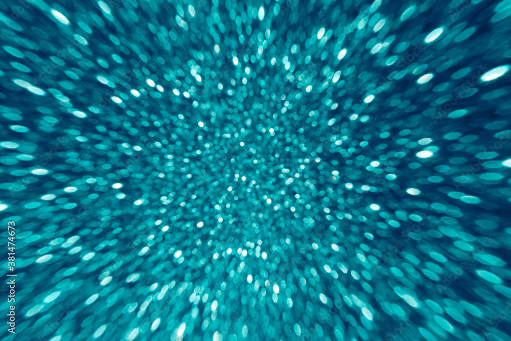 Abstract bokeh background with motion zoom effect toned blue color Abstract bokeh background with motion zoom effect toned blue color