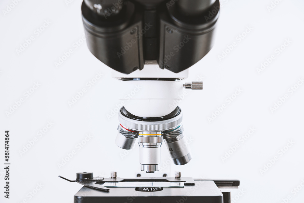 Using a biological microscope. Close up of a microscope. Scientific research concept, using a microscope. Medical examinations, searching for bacteria, diseases, blood tests. Using a biological microscope. Close up of a microscope. Scientific research concept, using a microscope. Medical examinations, searching for bacteria, diseases, blood tests.