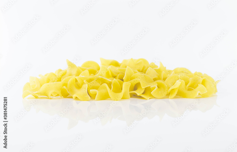 Uncooked Italian pasta on white background