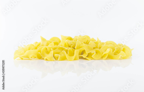 Uncooked Italian pasta on white background