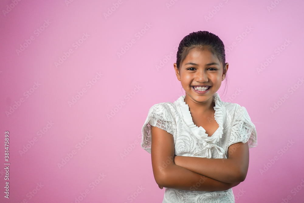 Portrait of happy smiling asian child girl isolated on pink background. Portrait of happy smiling asian child girl isolated on pink background.