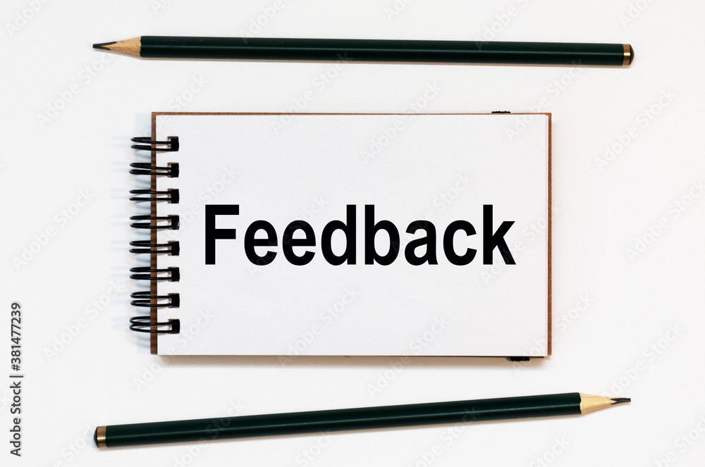 WHITE SPIRAL NOTEBOOK, TWO PENCILS WITH TEXT FEEDBACK WHITE SPIRAL NOTEBOOK, TWO PENCILS WITH TEXT FEEDBACK