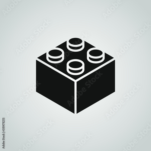 A black vector icon of a toy building block on a gray background.