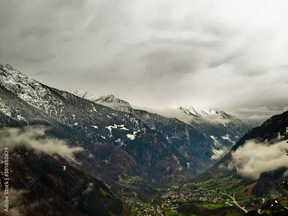 Mountains covered with snow and clouds, the Alps, Switzerland, Europe