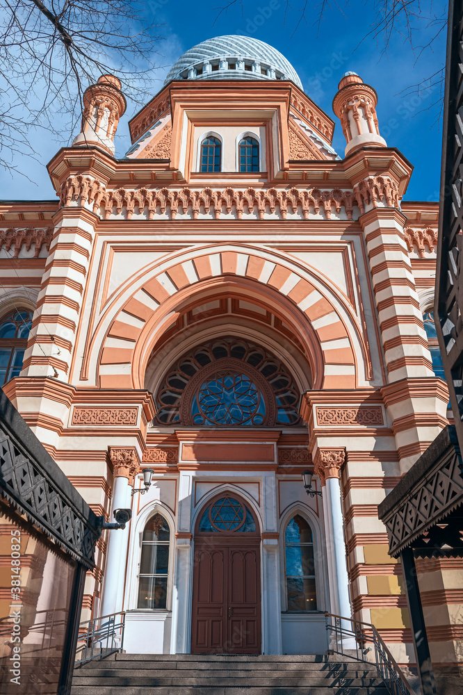 St. Petersburg, Russia - March 14, 2020 - view of the beautiful facade and the entrance to the synagogue against the blue sky
