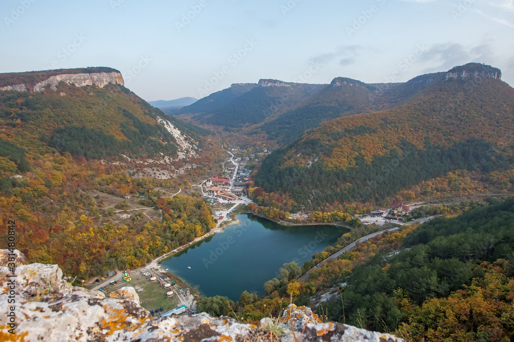 Beautiful autumn landscape with mountains and mountain lake. The colors of autumn.