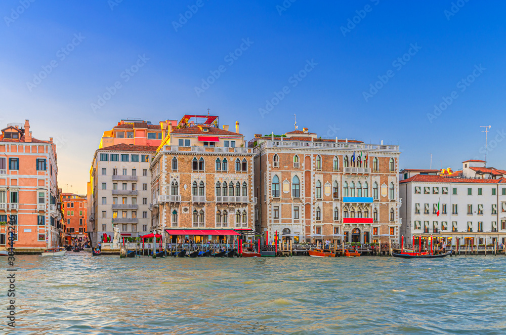 Ca Giustinian palace or Palazzo Giustinian building in San Marco sestiere on Grand Canal waterway in Venice historical city centre, blue clear sky background in the evening, Veneto Region, Italy