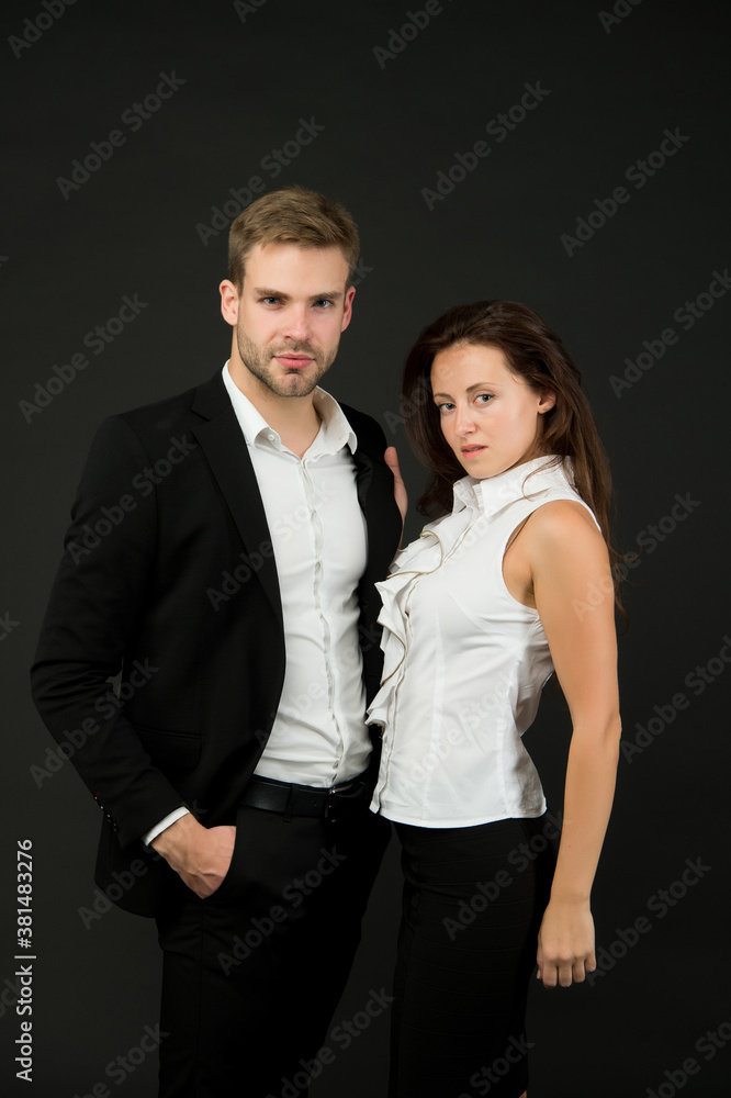 Business partners of handsome man and sensual woman wear formal fashion style dark background, couple Business partners of handsome man and sensual woman wear formal fashion style dark background, couple