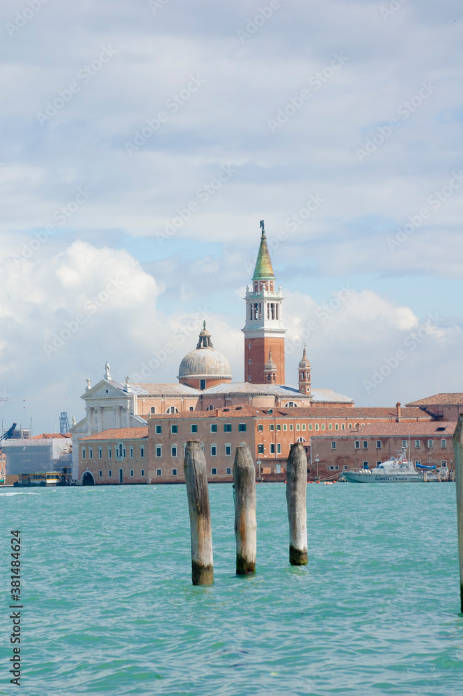 Venice, Basil. of San Marc's cathedral and the tower bell from la Gudecca island, sunny day, Venetian's lagoon