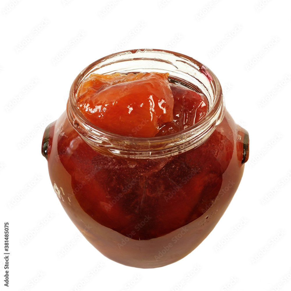 A plum jam in a round glass jar isolated on a white background A plum jam in a round glass jar isolated on a white background