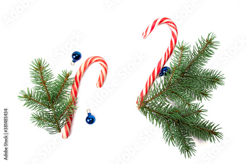 Christmas decorations, fir tree branches isolated on white background. Flat lay, top view, copy space. Christmas, winter, new year concept. Christmas composition for design.