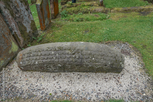 Luss, Scotland: 11th century Viking Hogback grave stone at the St. Kessog Church (1875) on Loch Lomond. photo