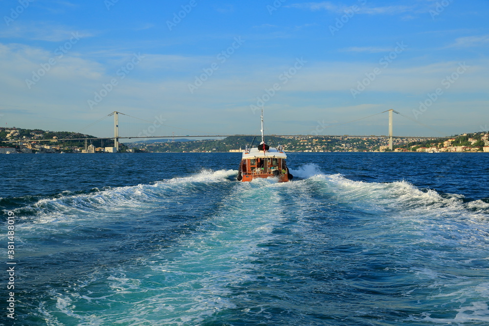 Panoramic view of the Bosphorus and the city on a clear day. Bosphorus bridge in the back. Istanbul, Turkey