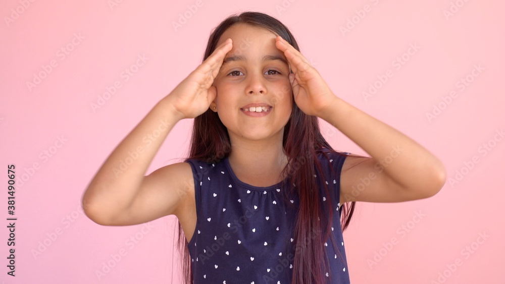 Girl playing hide and seek portrait. Cute little girl open her face with hands. Playing hide and seek Girl playing hide and seek portrait. Cute little girl open her face with hands. Playing hide and seek