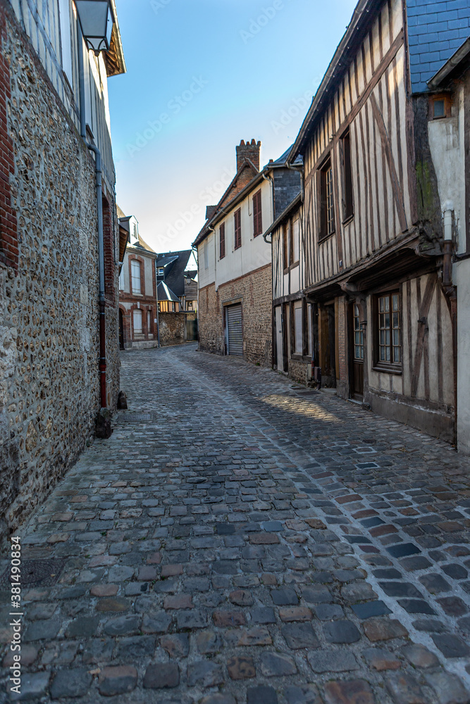 Alley with half timbeed medieval houses at the old town of Bernay, Eure, Normandy, France