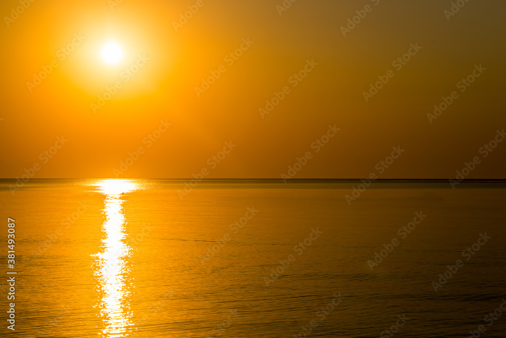 Beautiful sunrise over the horizon in the sea