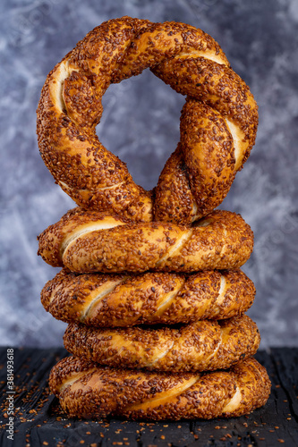 Canvas Print Bagel with sesame on black background