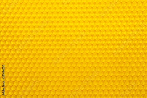 Background texture of a section of wax honeycomb from a hive. Beekeeping concept.