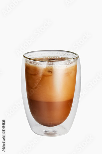 Ice coffee in a double-walled glass isolated on white