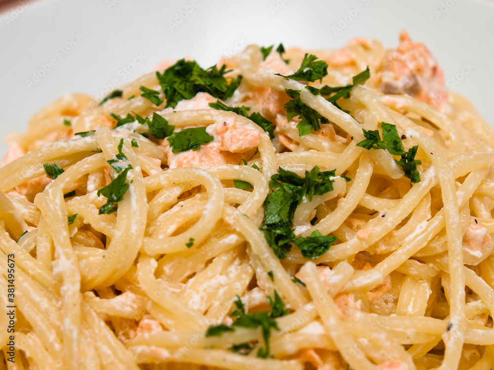Spaghetti with salmon and parsley
