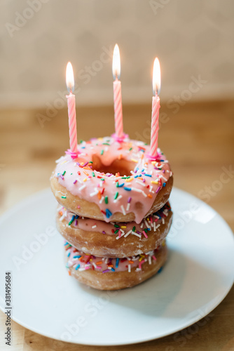 Birthday donut cake with candles