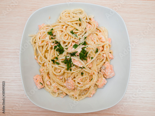 Spaghetti with salmon and parsley