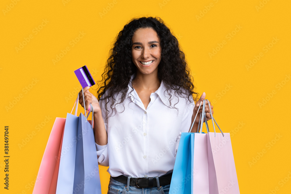 Easy Shopping. Happy Young Woman With Shopper Bags And Credit Card Easy Shopping. Happy Young Woman With Shopper Bags And Credit Card