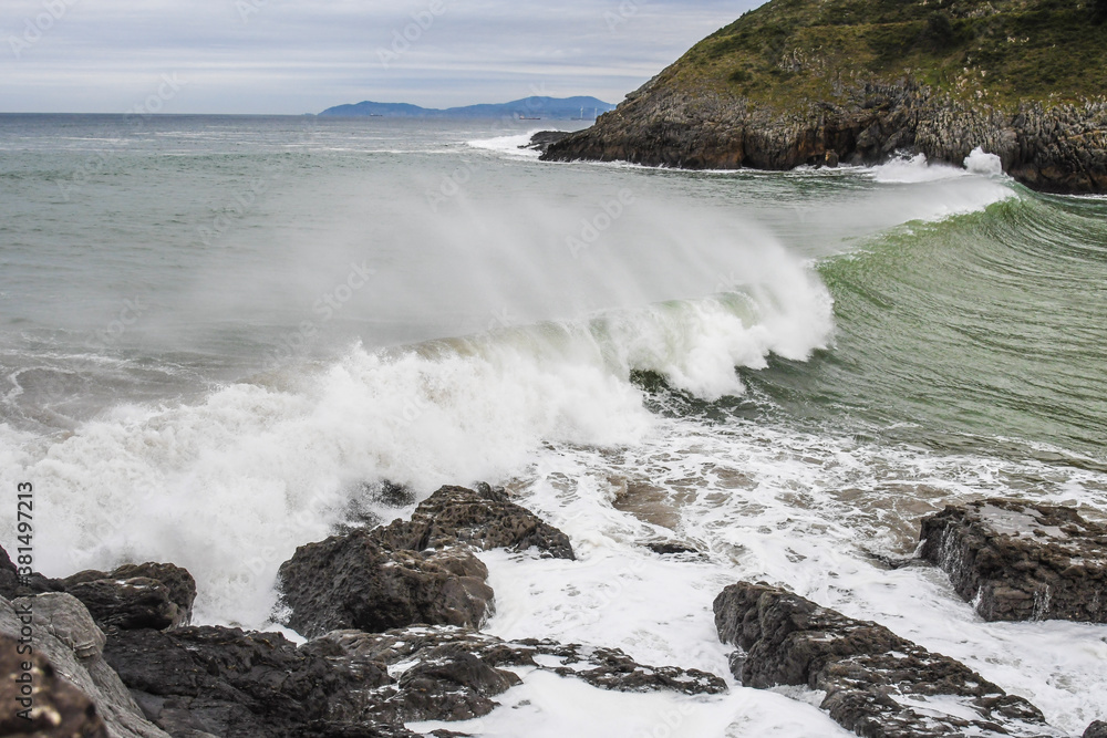 Waves crashing against the coast