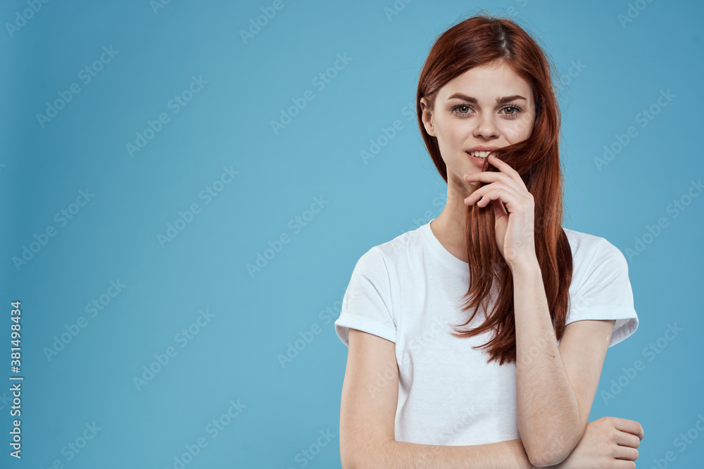 pretty woman white tshirt long hair glamor lifestyle cropped view blue background pretty woman white tshirt long hair glamor lifestyle cropped view blue background