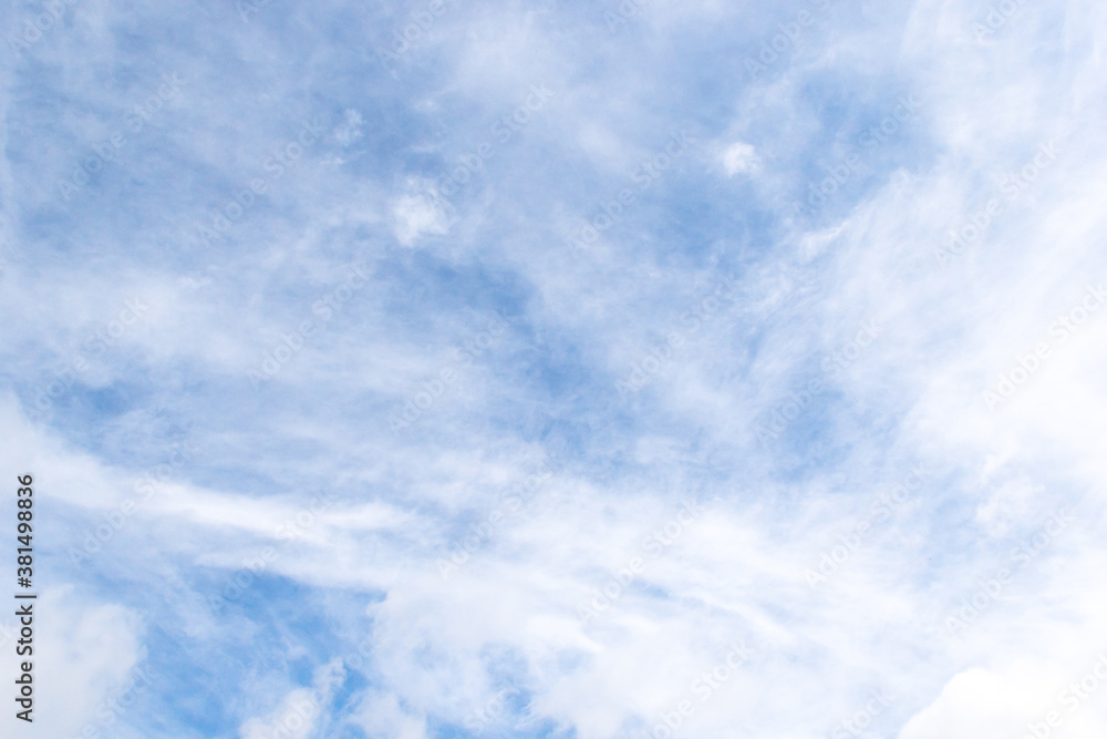 plumose clouds of the top tier in blue space of the sky