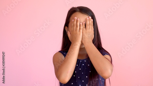 Photos Girl playing hide and seek portrait