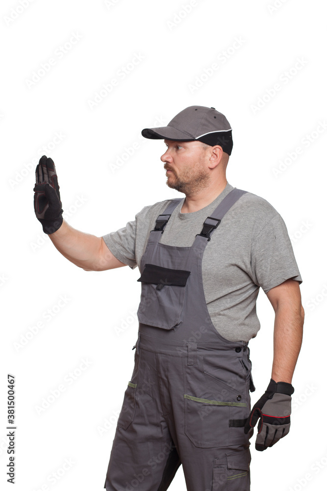 Car mechanic in 40 years holding clock and showing signs with hand isolated on white background Car mechanic in 40 years holding clock and showing signs with hand isolated on white background