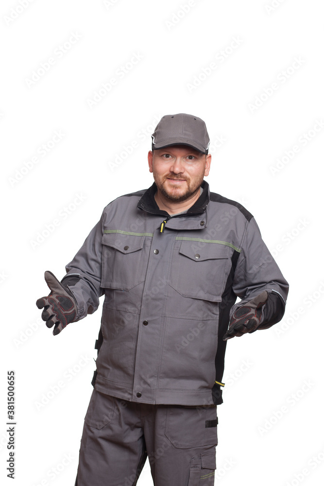 Car mechanic in 40 years holding clock and showing signs with hand isolated on white background Car mechanic in 40 years holding clock and showing signs with hand isolated on white background