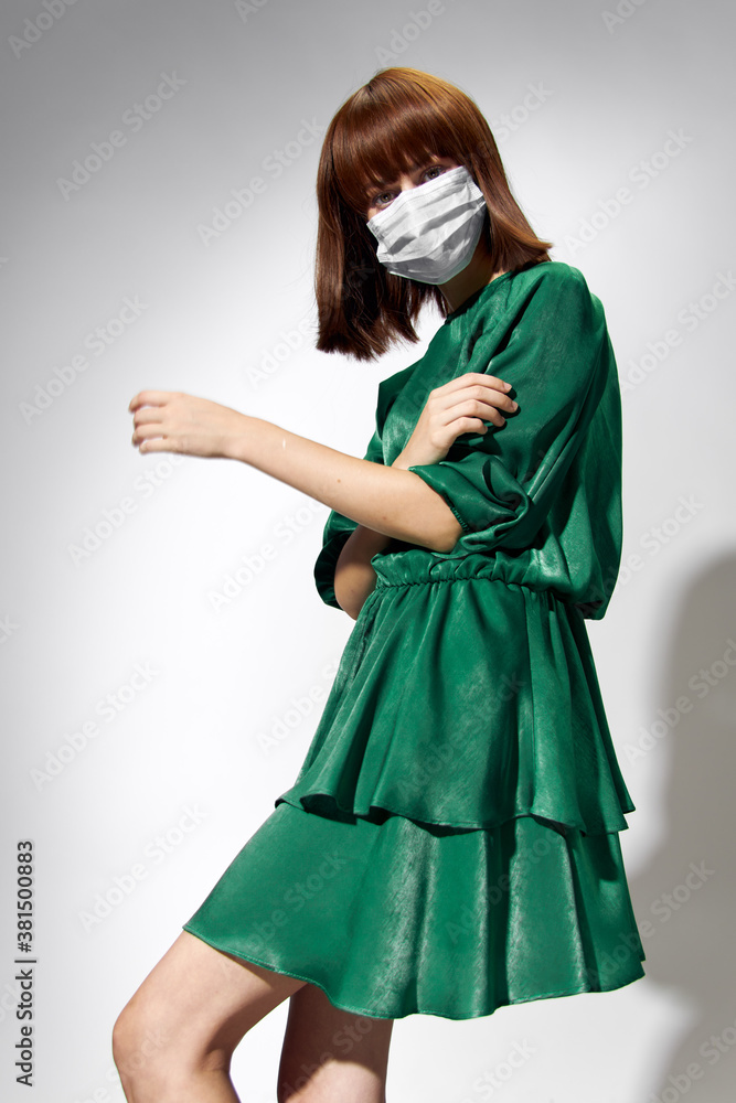 Fashion female coronavirus, model posing with gloves and protective medical mask Fashion female coronavirus, model posing with gloves and protective medical mask