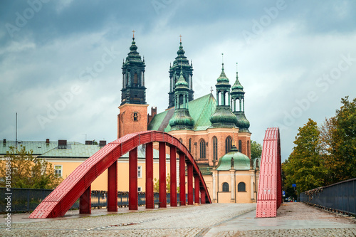 The Red Bridge to Tumskiy Island, view in rainy day: Poznan / Poland - September 28, 2020