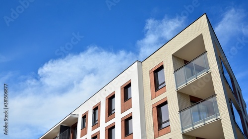 Futuristic square architecture of apartment building for real estate with big windows.