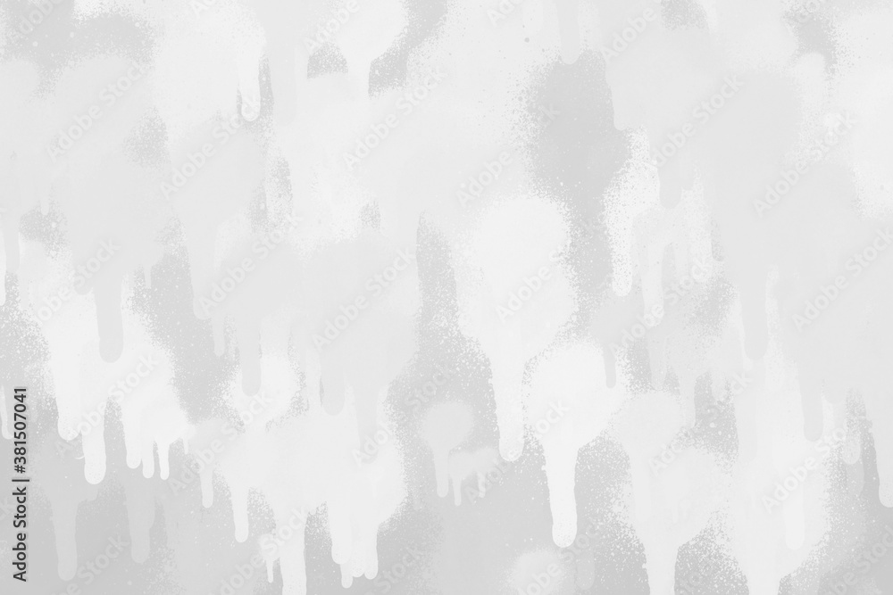 White spray paint ink texture. Graffiti painting on the wall. Street art and vandalism. Digitally airbrushed paper background.