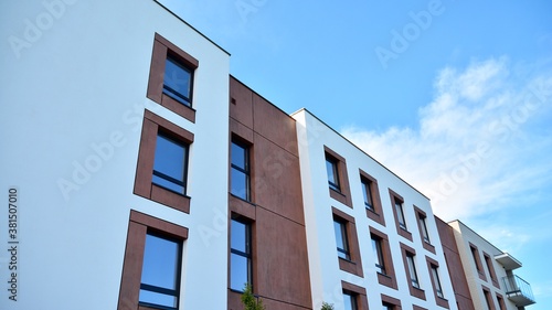 Futuristic square architecture of apartment building for real estate with big windows.