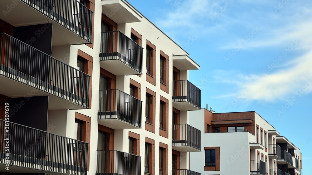 Futuristic square architecture of apartment building for real estate with big windows.