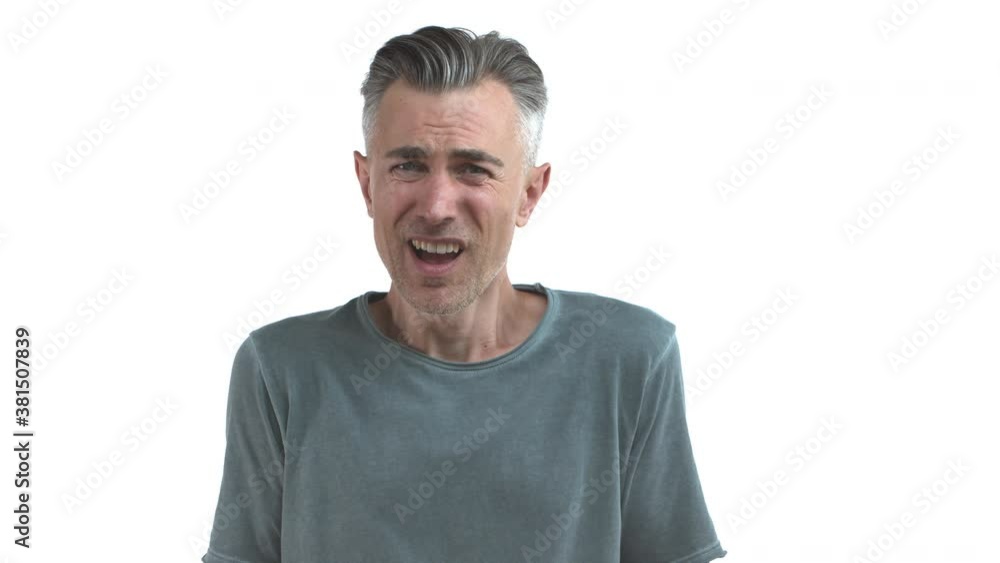 Confused pissed-off middle-aged man with grey hair and bristle cant understand something, shaking head puzzled and raising hands up, shrugging, standing over white background Confused pissed-off middle-aged man with grey hair and bristle cant understand something, shaking head puzzled and raising hands up, shrugging, standing over white background