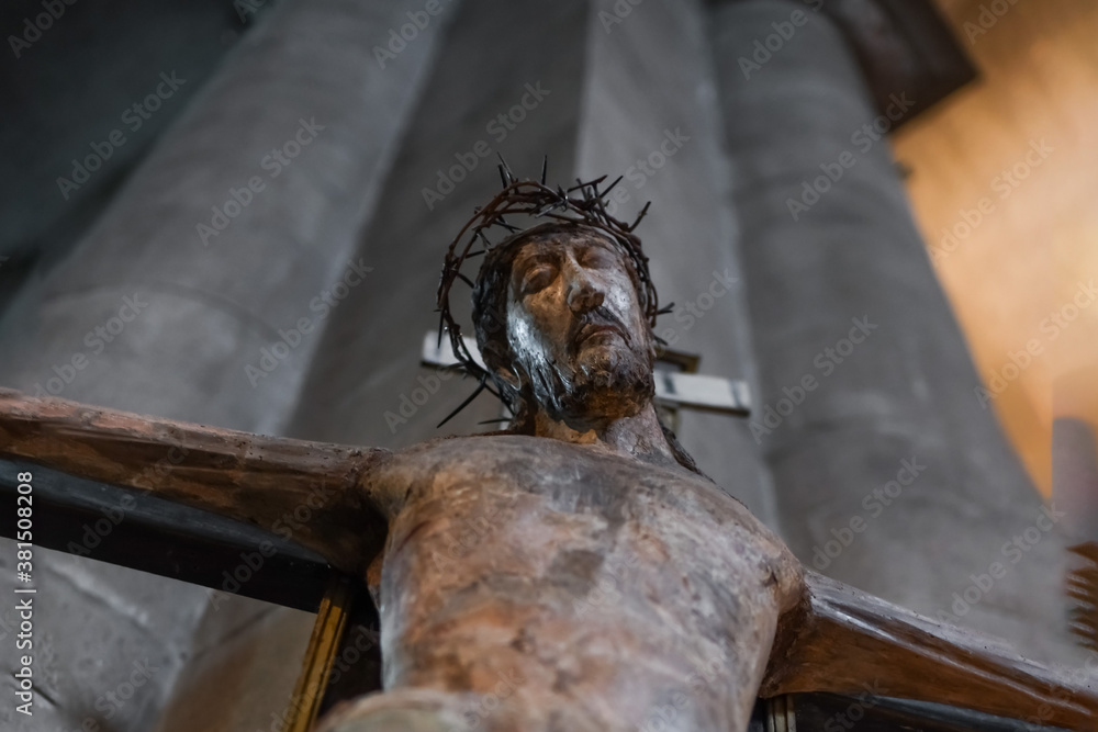 A statue of Jesus hanging from a cross