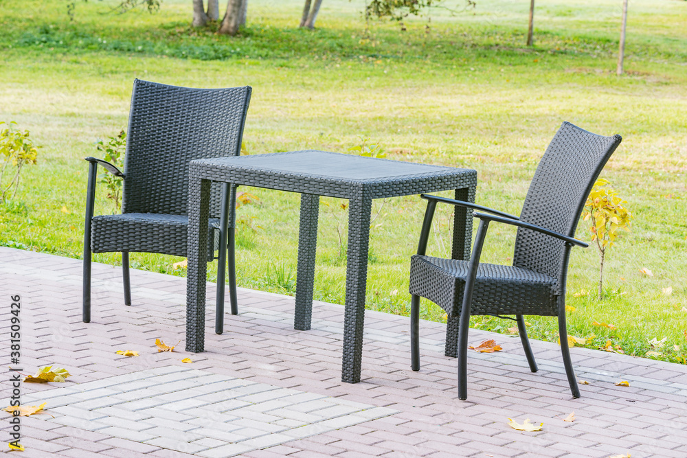 Armchairs of the street cafe in the city park. Armchairs of the street cafe in the city park.