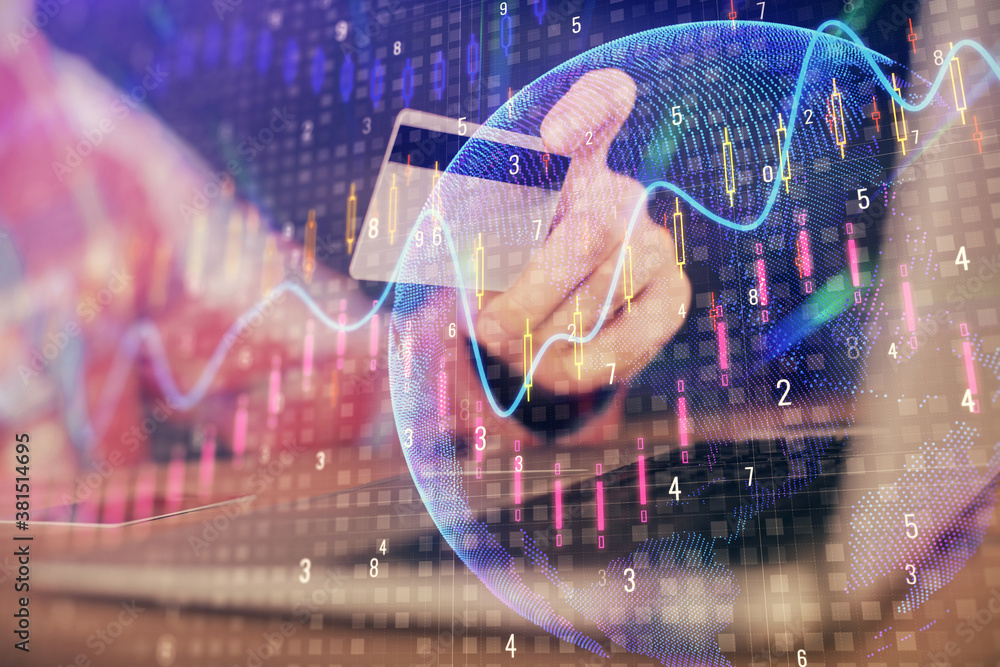 Double exposure of man hands holding a credit card and Forex graph drawing. Stock trading and digital fintech in Internet E-commerce concept. Double exposure of man hands holding a credit card and Forex graph drawing. Stock trading and digital fintech in Internet E-commerce concept.