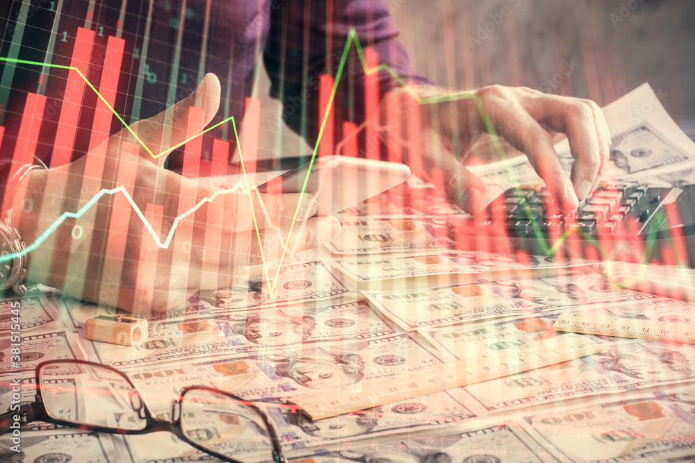 Double exposure of man's hands holding and using a digital device and forex graph drawing. Financial market concept. Double exposure of man's hands holding and using a digital device and forex graph drawing. Financial market concept.