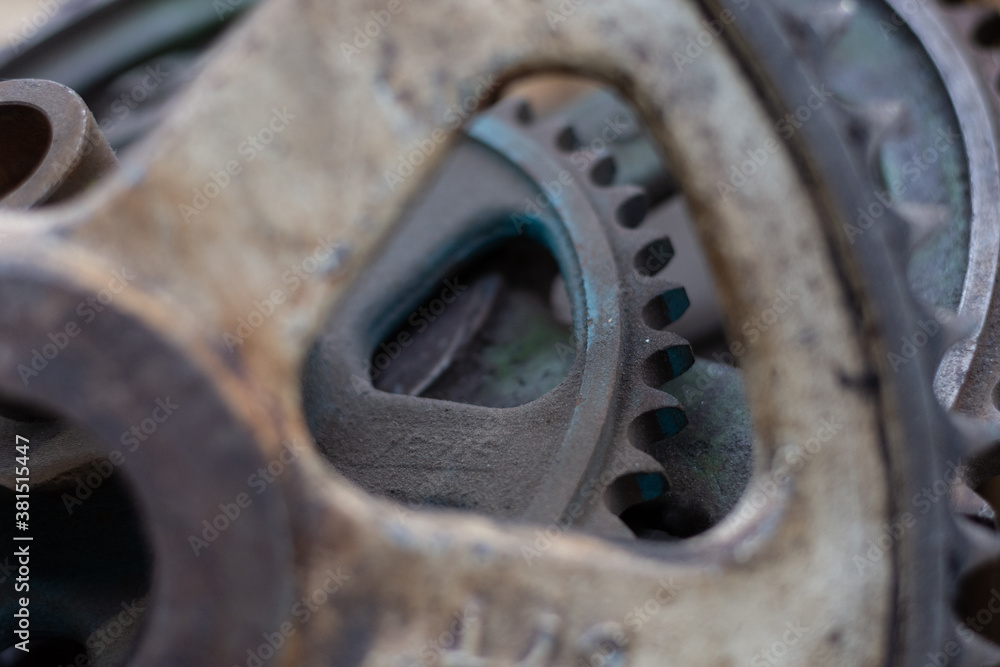 Close up of discarded metal cogs in a pile Close up of discarded metal cogs in a pile