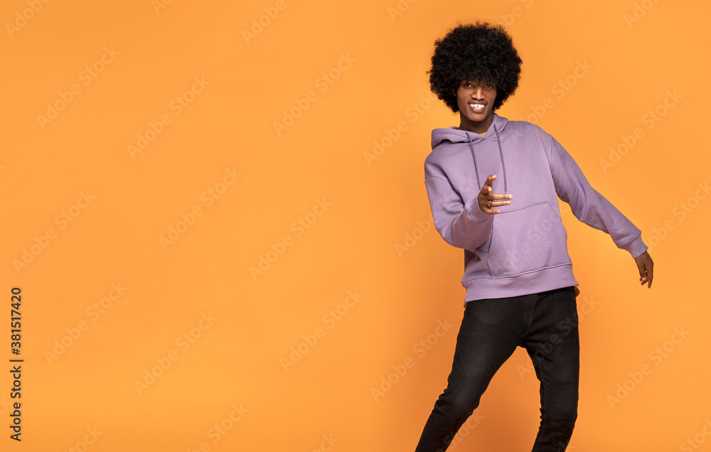 Afro man dancing and smiling. Afro man dancing and smiling.