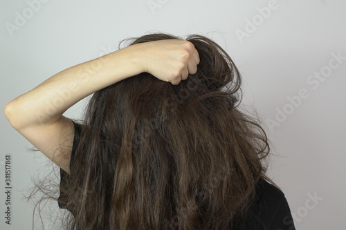 angry woman with frizzy long hair