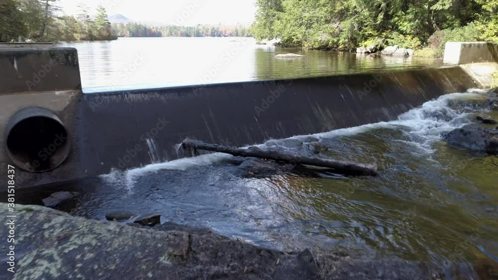 Aerial Drone - Fly Over Small Artificial Lake Spillway in Fall in Chittenden, Vermont. Aerial Drone - Fly Over Small Artificial Lake Spillway in Fall in Chittenden, Vermont.