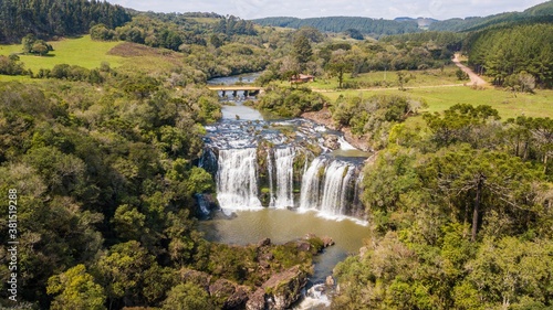 Aerial view of the S  o Marcos River Cascade. Beautiful waterfall among trees in the Serra Ga  cha