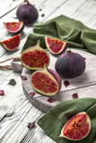 Juicy ripe figs. Whole fruit and cut into halves. Healthy, fortified, dietary food.